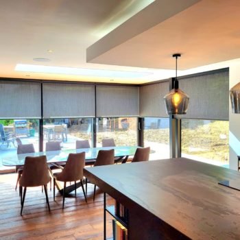 modern look of sunsreen roller blinds for dinning area with motorized option by dubai office blinds shop